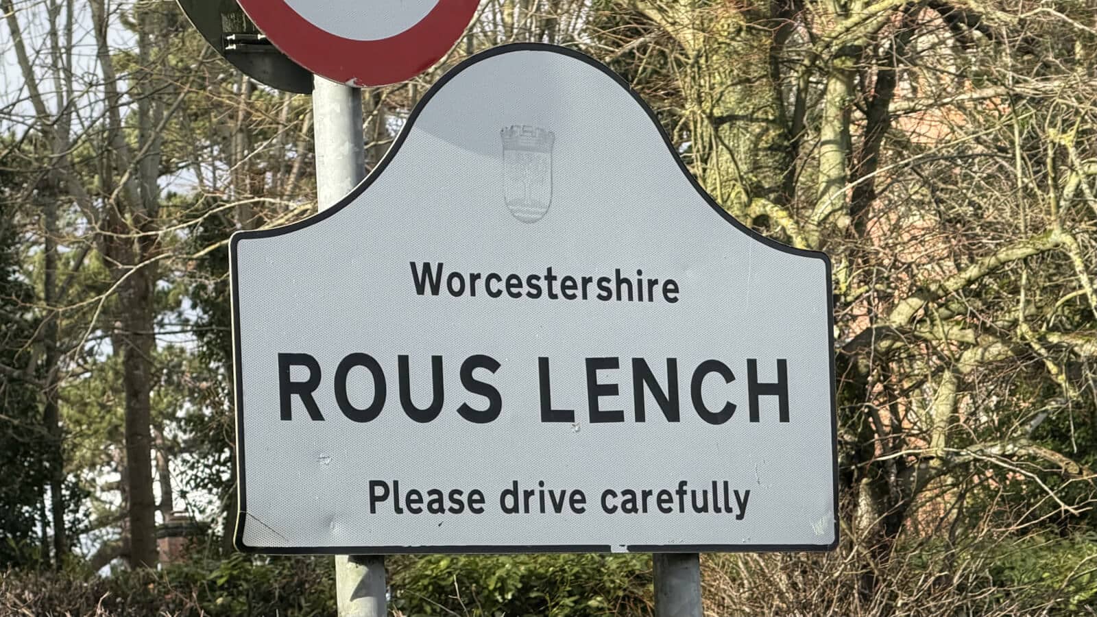 Rous Lench village road sign